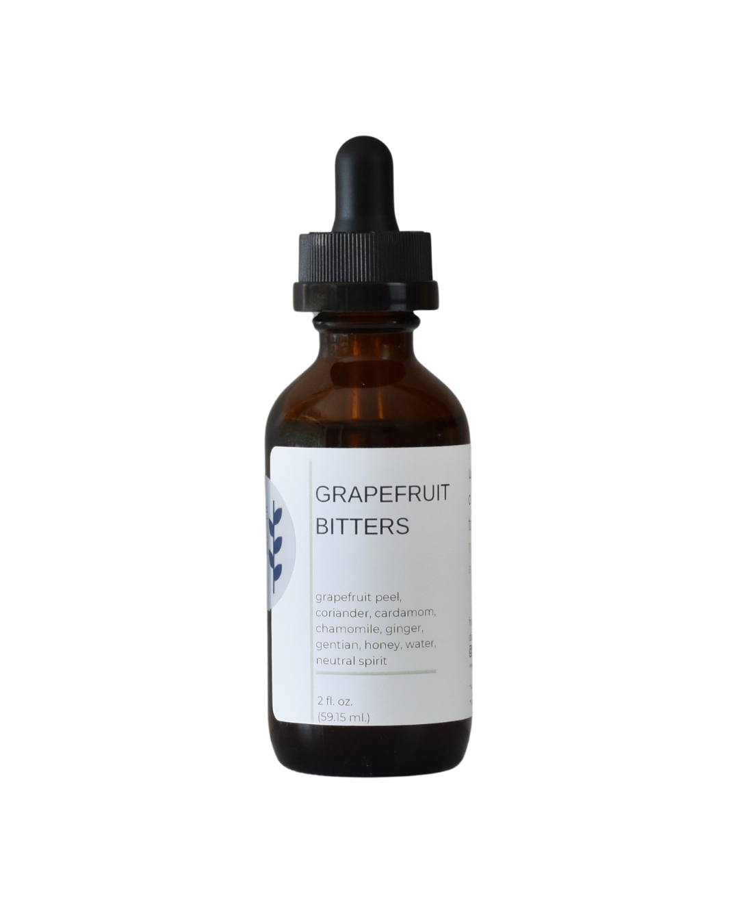 A bottle of FreeWildShe Grapefruit Bitters. The bottle is brown, the dropper top is black, and the label is white with navy & gray text. The background of the image is transparent.