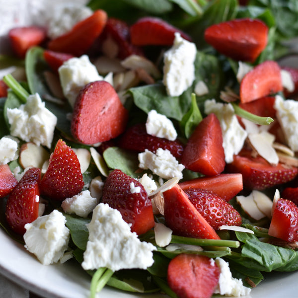 A fresh summer spinach salad with strawberries, feta, almonds and a playful Strawberry Hibiscus Bitters dressing. A curious bitters recipe beyond drinks.
