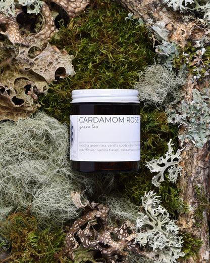 FreeWildShe Cardamom Rose Green Tea 20 servings sits on moss & lichen.