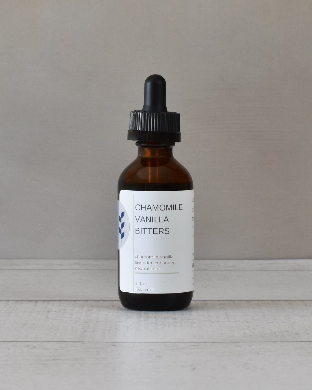 FreeWildShe Chamomile Vanilla Bitters sit on a white countertop.