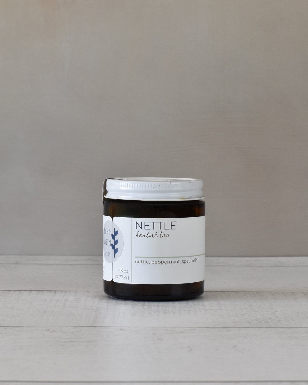 FreeWildShe Nettle Tea 20 servings sits on a white countertop.